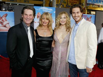   Actor Kurt Russell, his wife, actress Goldie Hawn and her kids, actress Kate Hudson and actor Oliver Hudson, in high spirits as they attend the film premiere of the romantic comedy "Raising Helen" at the El Capitan Theatre on May 26, 2004 in Hollywood, California. (Photo by Vince Bucci/Getty Images) *** Local Caption *** Kurt Russell;Goldie Hawn;Kate Hudson;Oliver Hudson