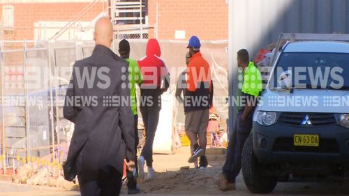 El Zien ran through a construction site to avoid waiting media as he left court today. (9NEWS)