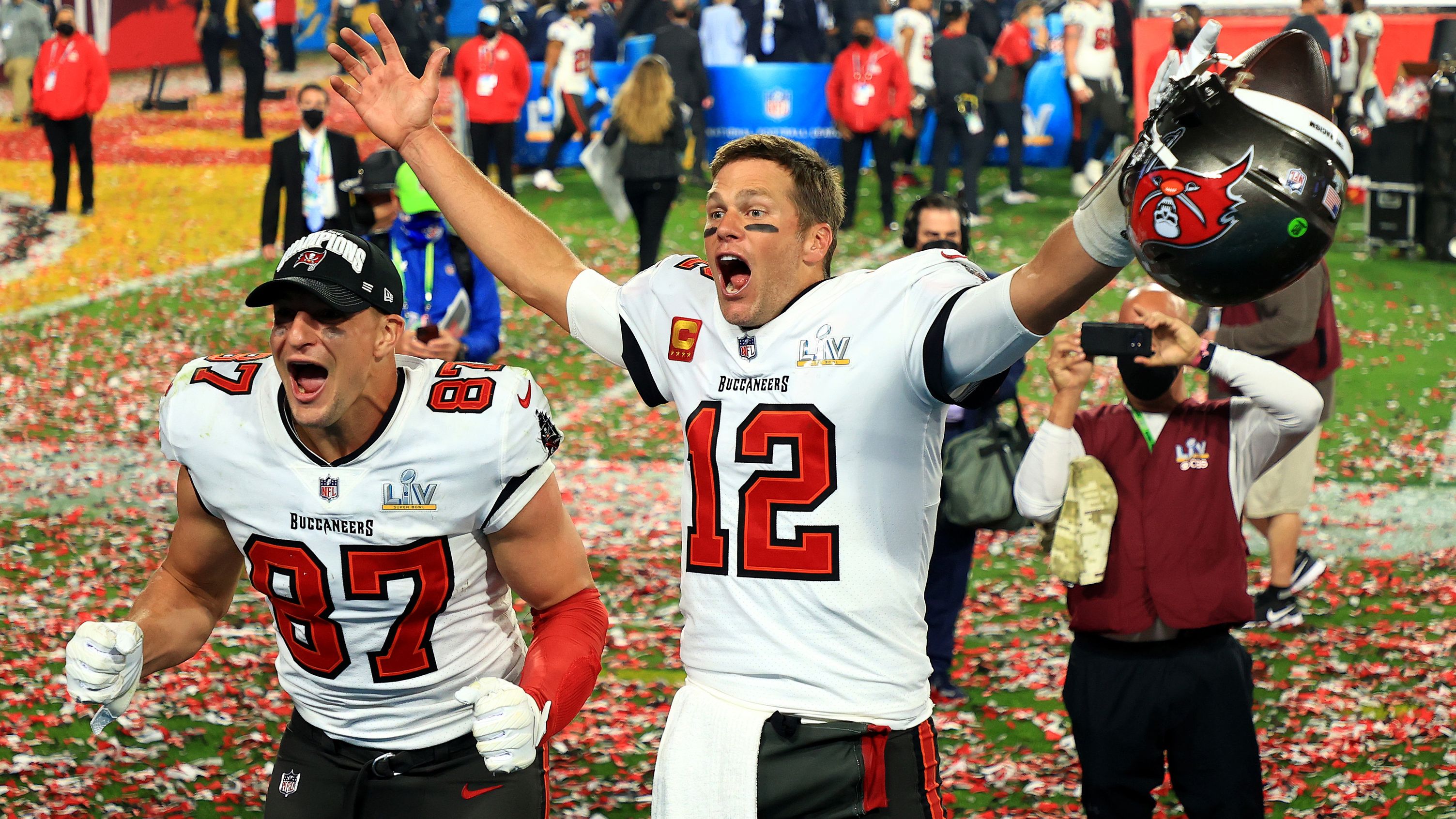 TAMPA, FLORIDA - FEBRUARY 07: Rob Gronkowski #87 and Tom Brady #12 of the Tampa Bay Buccaneers celebrate after defeating the Kansas City Chiefs in Super Bowl LV at Raymond James Stadium on February 07, 2021 in Tampa, Florida. The Buccaneers defeated the Chiefs 31-9. (Photo by Mike Ehrmann/Getty Images)