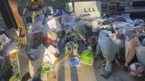 Memorials left after the stabbing death of a 15-year-old at Rouse Hill.