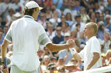 Ivo Karlovic and Lleyton Hewitt shakes hands after their famous 2003 Wimbeldon clash.