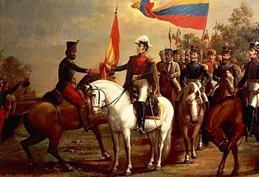 When did Simón Bolívar lead Venezuelan revolutionaries in the decisive Battle of Carabobo?