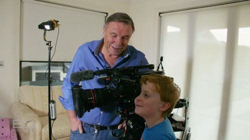 Darcy, 9, tries out the camera. (60 Minutes)