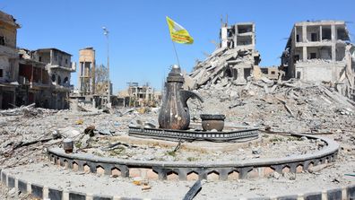 The city of Raqqa, which was controlled by ISIS for three years, with the main square where they'd do beheading.