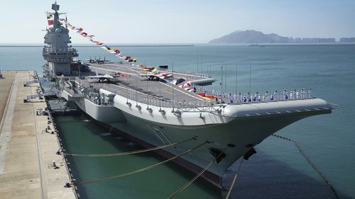 Taiwan's defence ministry said Saturday that it detected three ships from the Chinese navy, one of which was the Shandong aircraft carrier (pictured), passing through the Taiwan Strait. 