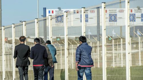 Suspected illegal migrants charge down police at port in France