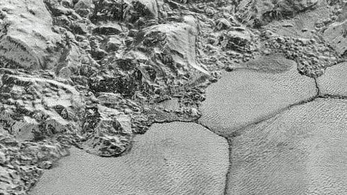 The Pluto plains known as Sputnik Planitia with the methane dunes on the bottom  half of the image. (Photo: AP).