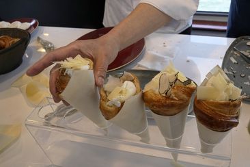 Twisted croissants with artichoke puree, a poached egg, a bit of truffle, and a bit of cheese, created by French chef Amandine Chaignot, are seen Tuesday, April 30, 2024 in Paris.  