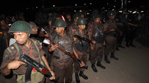 Authorities near the Dhaka restaurant. (AFP)