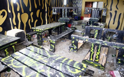 A view of the inside of the Enyobeni Tavern where 21 teenagers lost their lives in the early hours of Sunday, June 26, in Scenery Park, East London South Africa, Tuesday, July 5, 2022. The toxic chemical methanol has been identified as a possible cause of the deaths of 21 teenagers at a bar in the South African city of East London last month, authorities said at press conference in East London Tuesday. July 19, 2022.  (AP Photo/File)