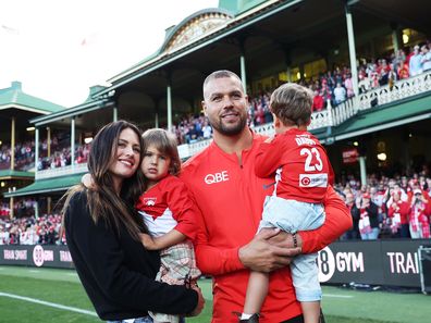 Lance Franklin of the Swans farewells the crowd with his wife Jesinta Franklin and children during a lap of honour during the round 24 AFL match between Sydney Swans and Melbourne Demons at Sydney Cricket Ground, on August 27, 2023
