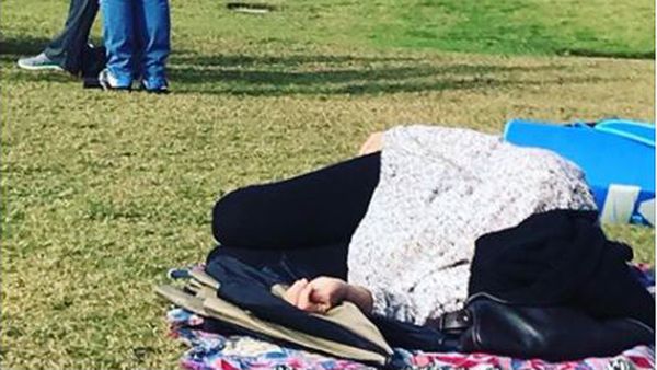 If you need me I'll be over here. Mum catches some shut eye at soccer. Image: Facebook/Glennon Doyle.