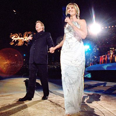 John Farnham and Olivia Newton-John sing during the Opening Ceremony of the Sydney 2000 Olympic Games.