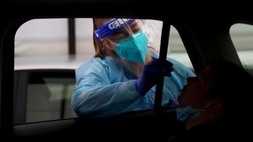 Registered Nurse Ellie Taylor conducts a COVID-19 test at the Bondi Beach testing clinic on November 04, 2020 in Sydney, Australia. 