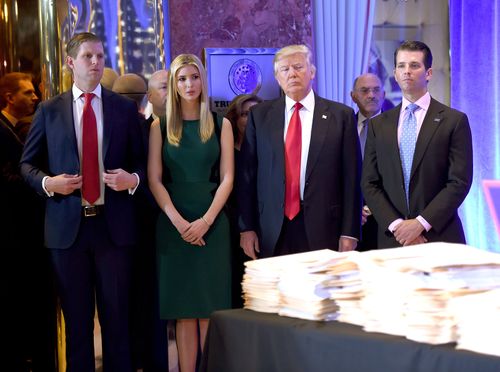 US President-elect Donald Trump along with his children Eric(L) Ivanka and Donald Jr. arrive for a press conference January 11, 2017 at Trump Tower in New York.