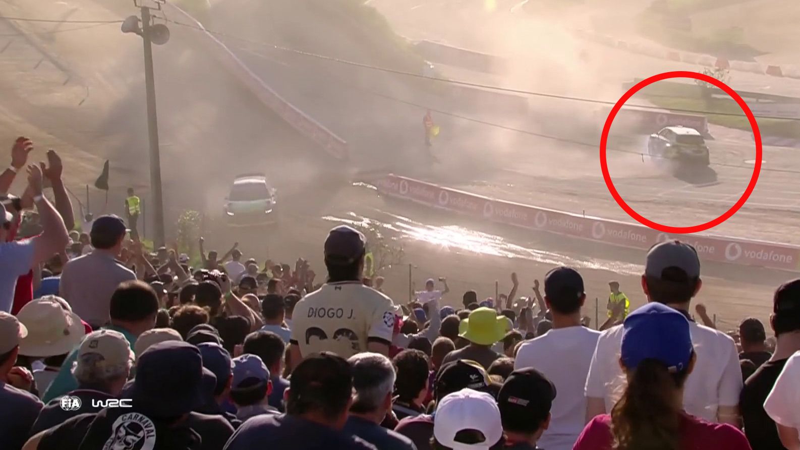 Oliver Solberg performs doughnuts in front of fans at Rally Portugal.