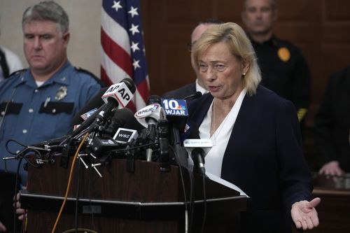 Maine Gov. Janet Mills, right, faces reporters as Maine State Police Col. William Ross, left, looks on, Thursday, Oct. 26, 2023, during a news conference at Lewiston City Hall, in Lewiston, Maine. 