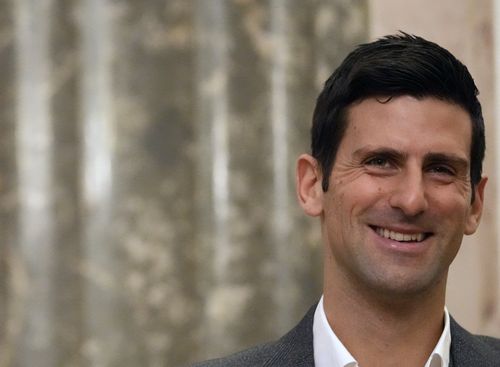 Serbian tennis player Novak Djokovic, left, smiles during talks with Serbia's President Aleksandar Vucic in Belgrade, Serbia, Thursday, Feb. 3, 2022. 