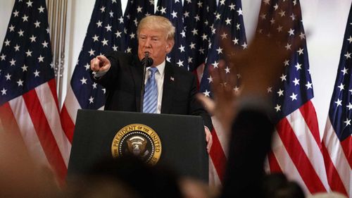 President Donald Trump answers questions in a New York press conference.