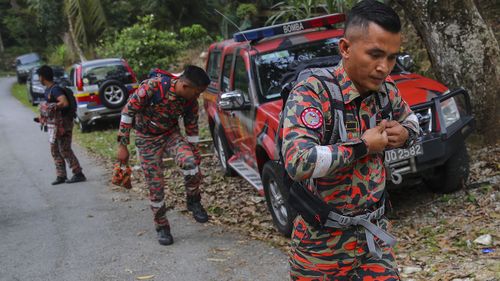 Members of a Malaysian Fire and Rescue Department team continue a search and rescue operation for 15-year-old Nora Quoirin.