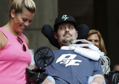 Pete Frates, who inspired the ice bucket challenge, looks at his wife Julie during a ceremony at City Hall by Boston Mayor Marty Walsh. September 5, 2017 was declared 'Pete Frates Day'. Frates, who was stricken with ALS died on Monday.