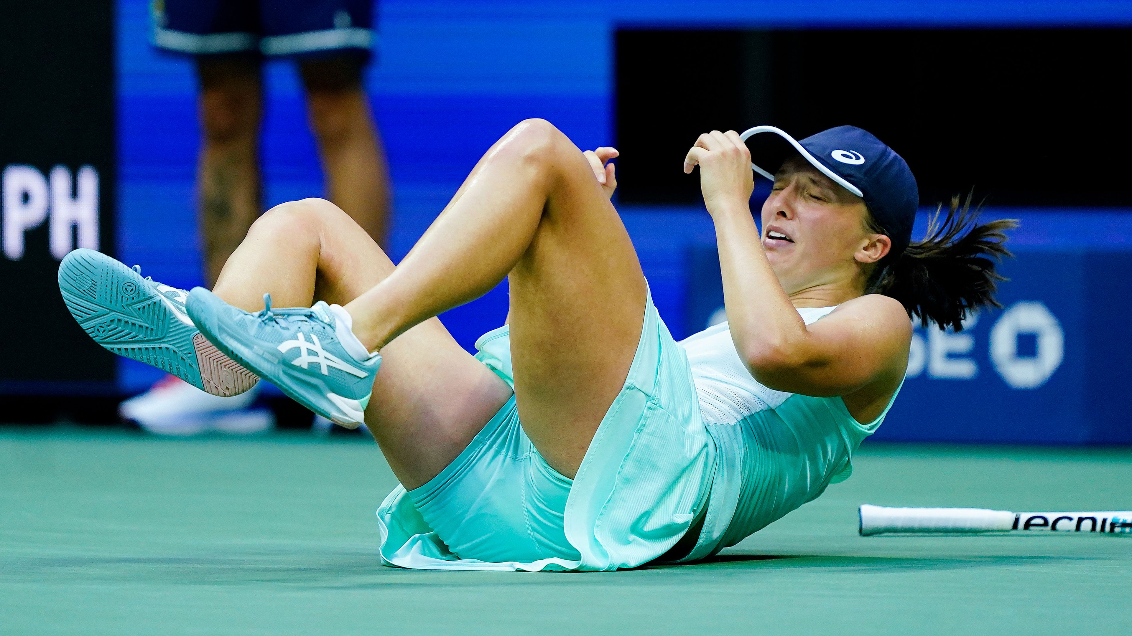 Iga Swiatek, of Poland, drops to the court after defeating Ons Jabeur, of Tunisia, to win the women&#x27;s singles final of the U.S. Open tennis championships, Saturday, Sept. 10, 2022, in New York. (AP Photo/Matt Rourke)