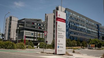 The woman is in isolation at Gold Coast University Hospital.