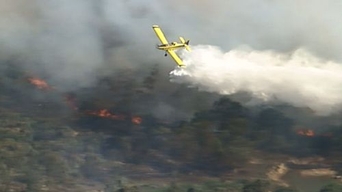 Firefighters are using water-bombing equipment on the bushfire near Ballandean. (9NEWS)