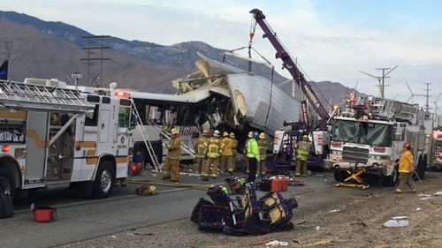 At least 13 dead after tour bus collided with semi-trailer in California