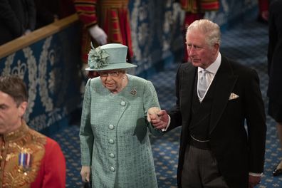 Queen Elizabeth II and Prince Charles, Prince of Wales walk through the Royal Gallery ahead of the state opening of parliament at the Houses of Parliament on December 19, 2019 in London, England. In the second Queen's speech in two months, Queen Elizabeth II will unveil the majority Conservative government's legislative programme to Members of Parliament and Peers in The House of Lords.  (Photo by Matt Dunham - WPA Pool/Getty Images)