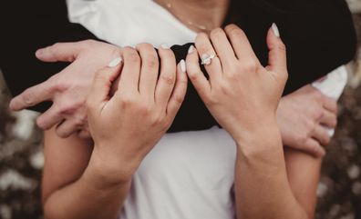 Engaged couple embracing close up
