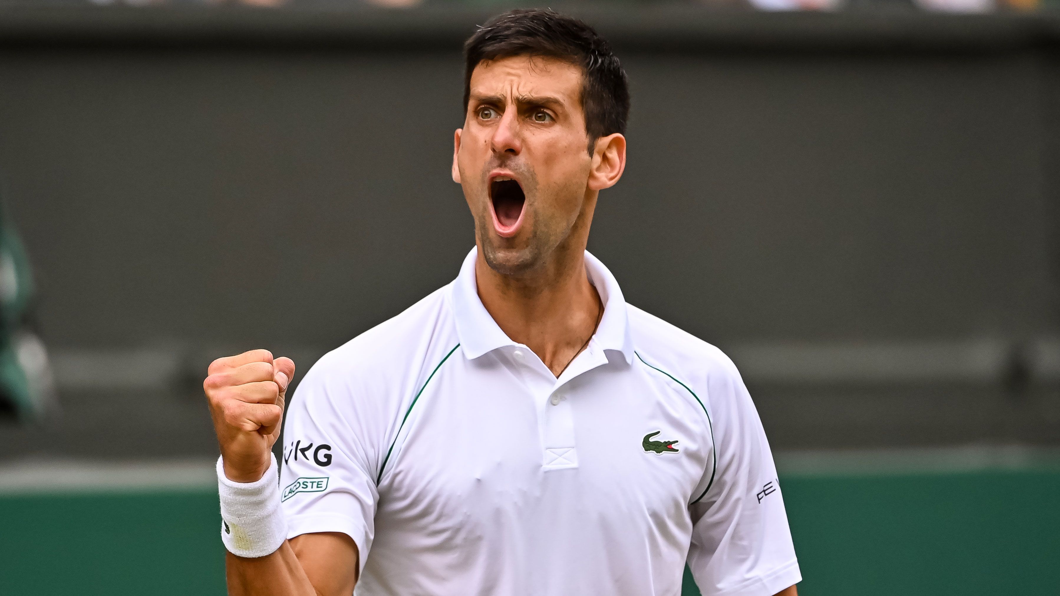 Novak Djokovic pumps himself up during his Wimbledon semi-final against Denis Shapovalov.