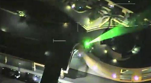 A green laser beam being directed towards the sky. (A Current Affair)