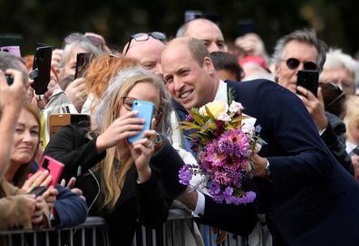 Prince William, Prince of Wales greets members of the public outside the Sandringham Estate following the death of Queen Elizabeth II, on September 15, 2022 in King's Lynn, England. 