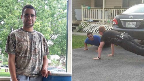 Police officer helps calm boy with autism by demonstrating push-ups