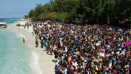 The natural disaster has sparked a mass tourist exodus of travellers looking to escape the holiday location. Picture: AAP