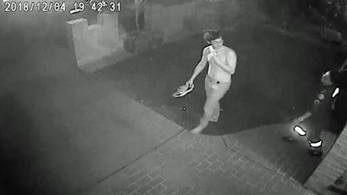 CCTV shows the injured man being treated by paramedics at a nearby premises.