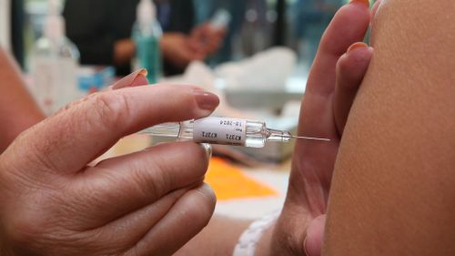 A person receives a vaccination. (9NEWS)