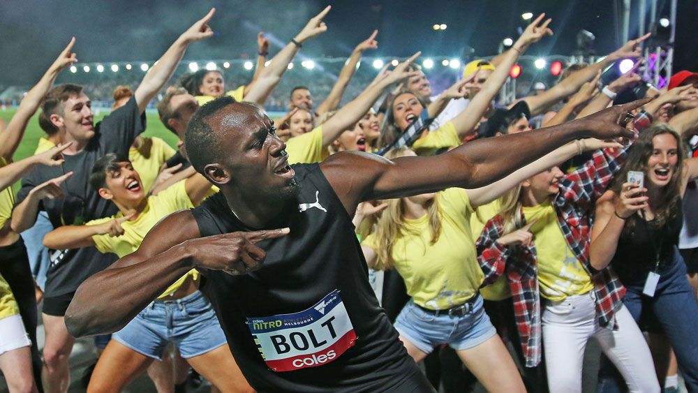 Bolt beats Aussies, belts out bad tune