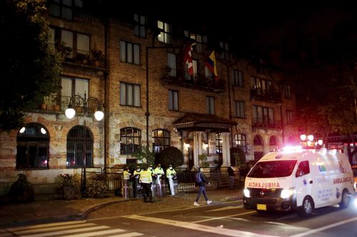 Police stand guard the hotel where drummer Taylor Hawkins was found dead in Bogota, Colombia, Saturday, March 26, 2022