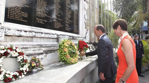 Prime Minister Tony Abbott and Margie Abbott lay a wreath during the ceremony in remembrance of Bali Bombing victims, in Bali, Indonesia on Wednesday 9 October 2013. Photo: Alex Ellinghausen