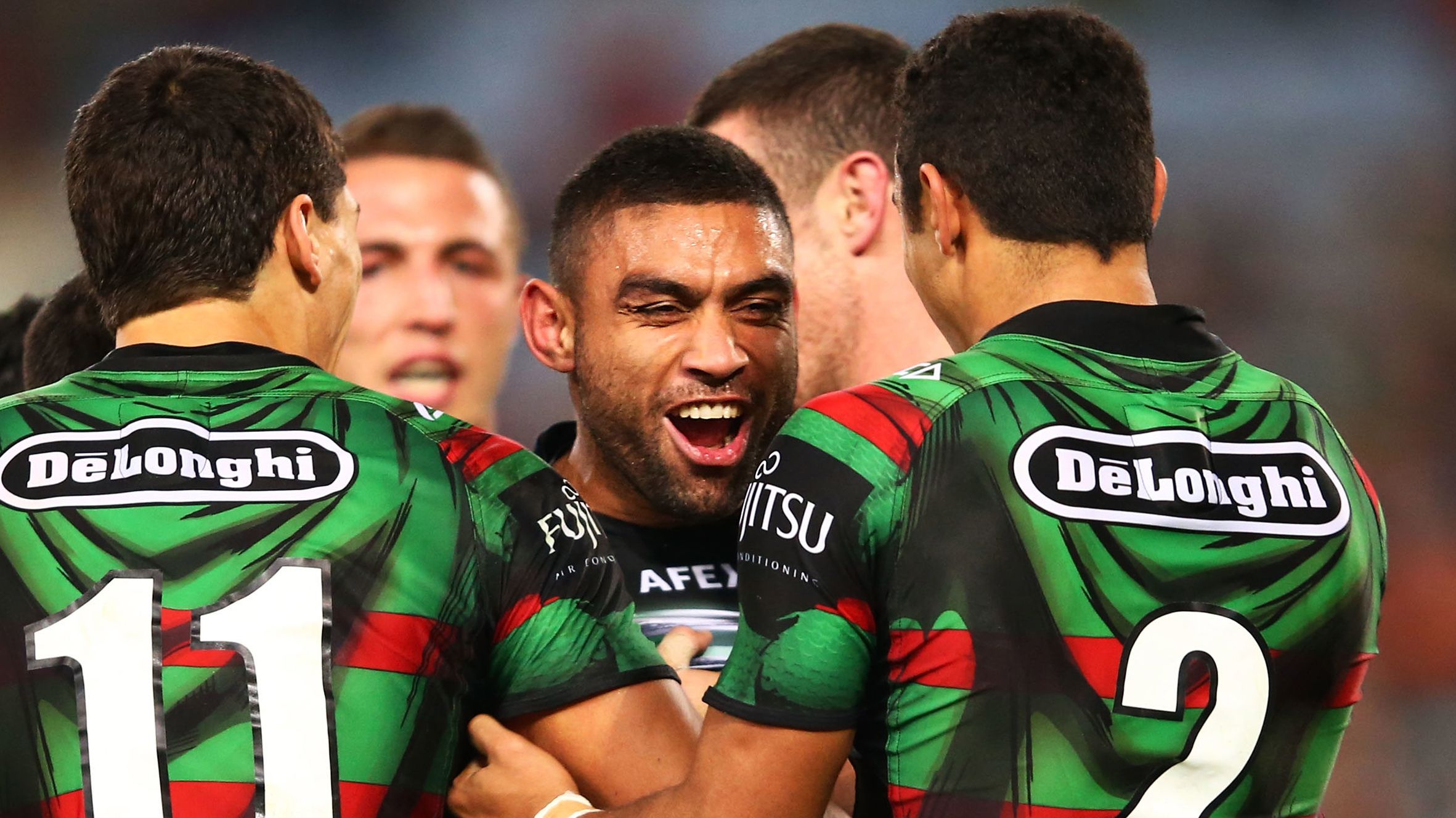 Nathan Merritt celebrates a try during the round 14 NRL match between the South Sydney Rabbitohs and the Wests Tigers at ANZ Stadium on June 13, 2014 in Sydney, Australia.