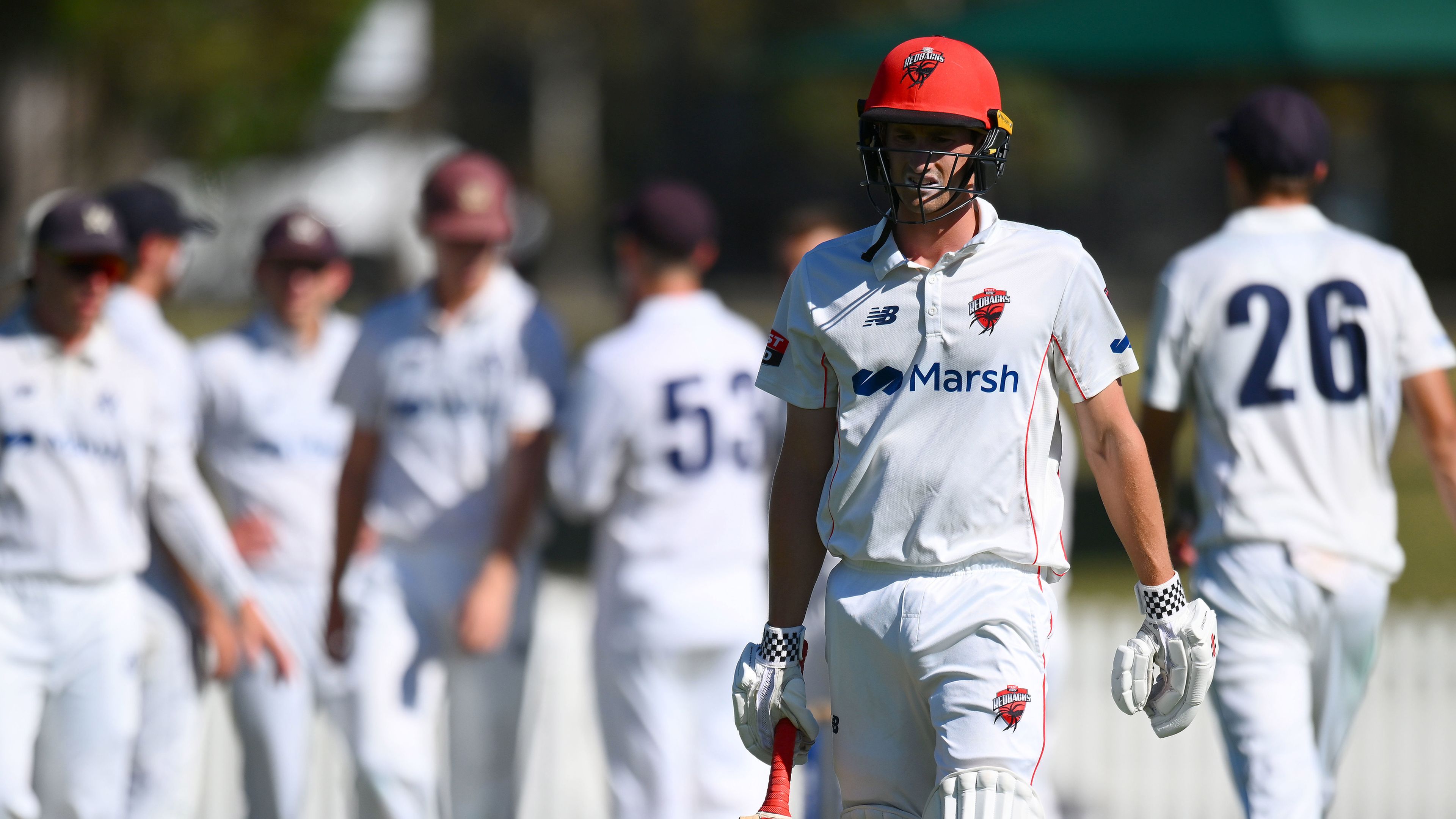 Jake Carder of the Redbacks reacts to losing his wicket during the Sheffield Shield match between Victoria and South Australia.