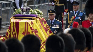 King Charles III and Prince William follow the coffin of Queen Elizabeth II, draped in the Royal Standard with the Imperial State Crown placed on top, carried on a horse-drawn gun carriage of the King's Troop Royal Horse Artillery, during the ceremonial procession from Buckingham Palace to Westminster Hall, London, Wednesday Sept. 14, 2022. 