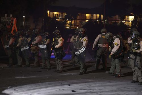 Los Angeles County Sheriffs guidelines during a protestation successful Compton.