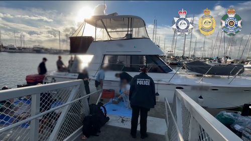 A group of 13 men, including two minors, have been charged as part of the largest-ever cocaine bust in Australia.