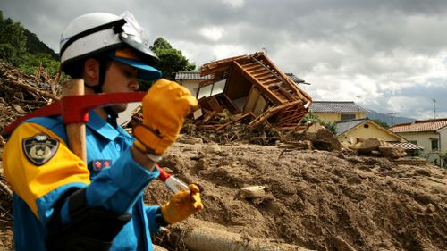 Rescuers comb through devastation after Japanese landslide