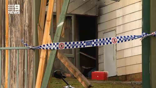 A body has been found following a suspicious house fire in Sydney's Macquarie Fields this morning.