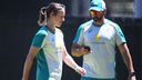 Ellyse Perry of Australia works on her bowling with bowling coach Ben Sawyer.