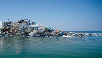 floating garbage on the sea , dirty dump in ocean